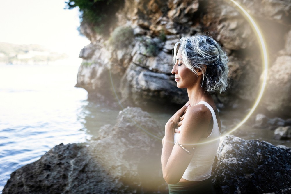 Ray of sunlight surrounding woman in reiki spiritual photoshoot