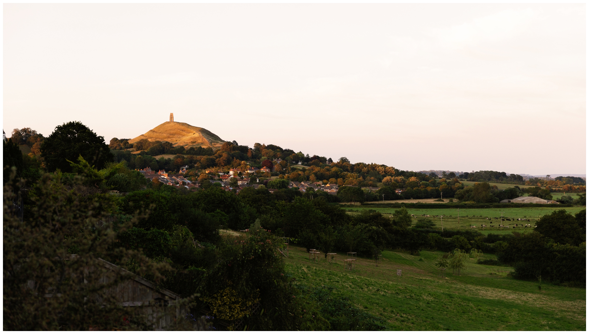 Somerset countryside landscape with Glastonbury Tor in the background during a spiritual women's retreat