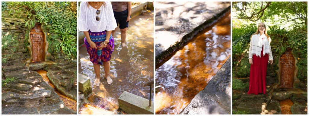 Pilgrims walking barefoot through the sacred Red Spring waters at Chalice Well in Glastonbury