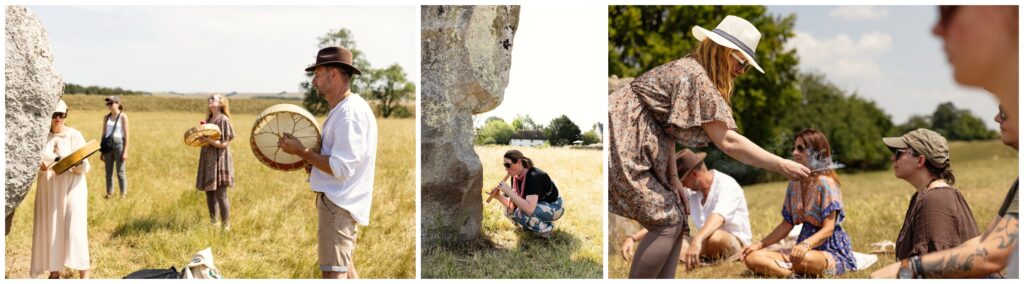 Retreat participants playing drums and sound healing instruments among the ancient stones at Avebury stone circle and sitting in circle ceremony
